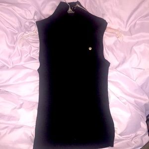 Beautiful designer Linda Lucia sleeveless knit top. Asymmetrical zipper.